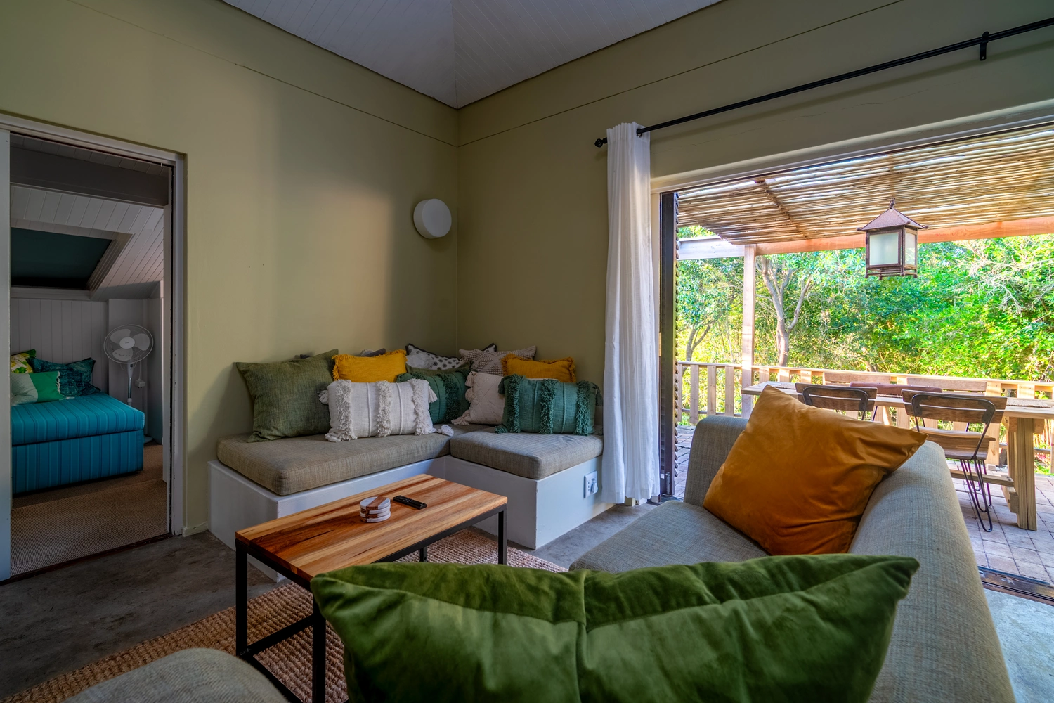 Living area opening up onto sunny patio.