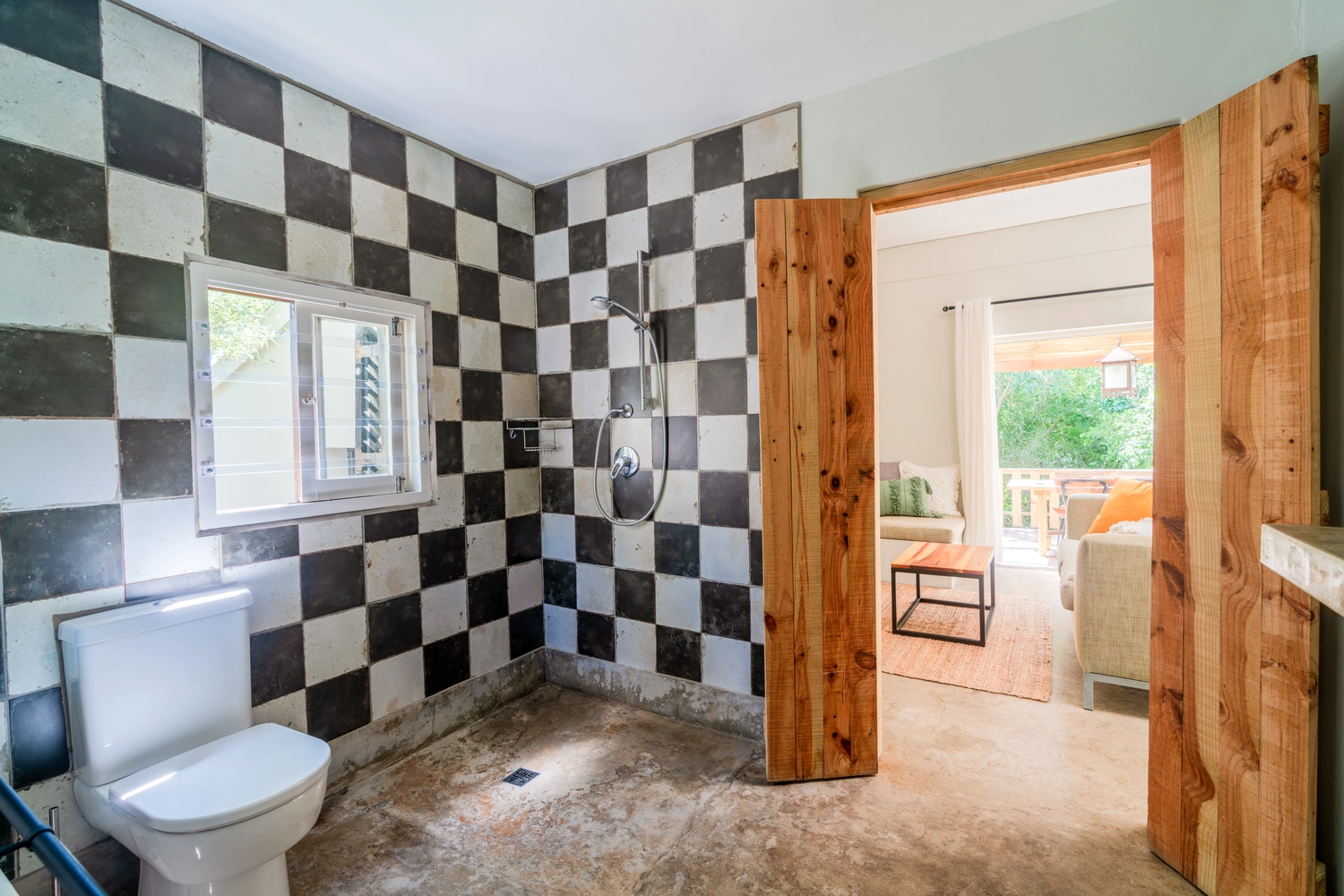 Large open wet room with shower and plenty hanging space.